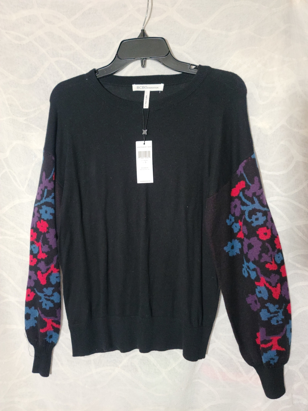 BCBGeneration Black Sweater with Colorful Floral Sleeves